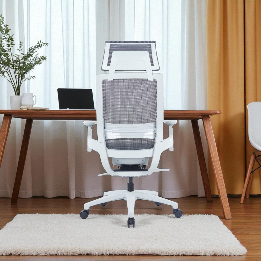 Ergonomic office chair in a home office setting with a wooden desk and curtains.