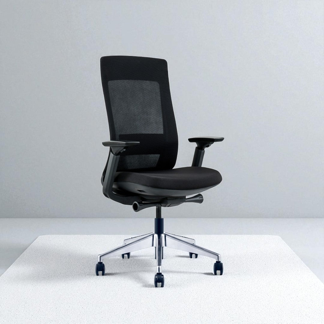 Black office chair with mesh backrest on a white platform and light gray background