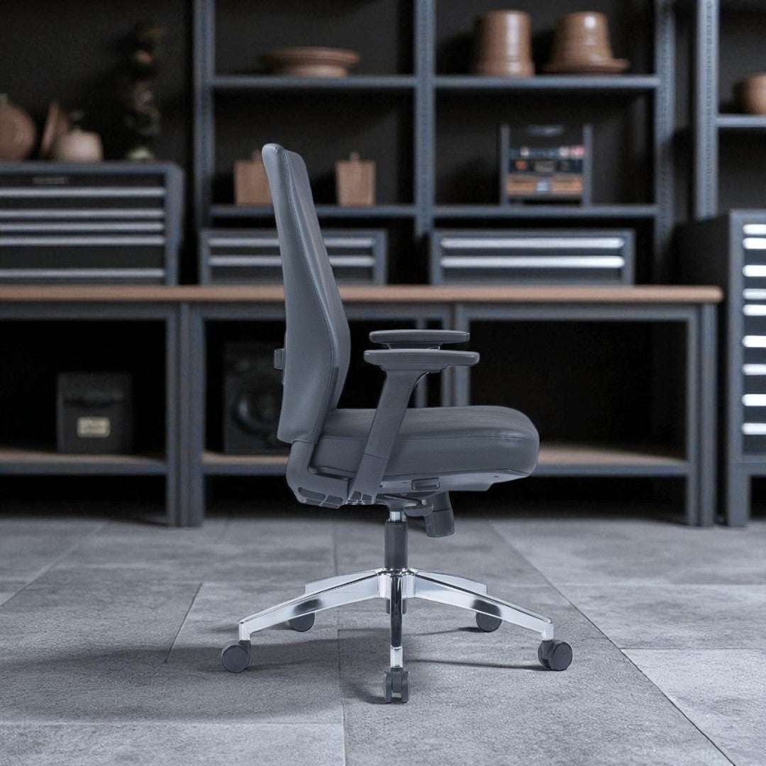 Gray office chair in a room with shelves and a desk.