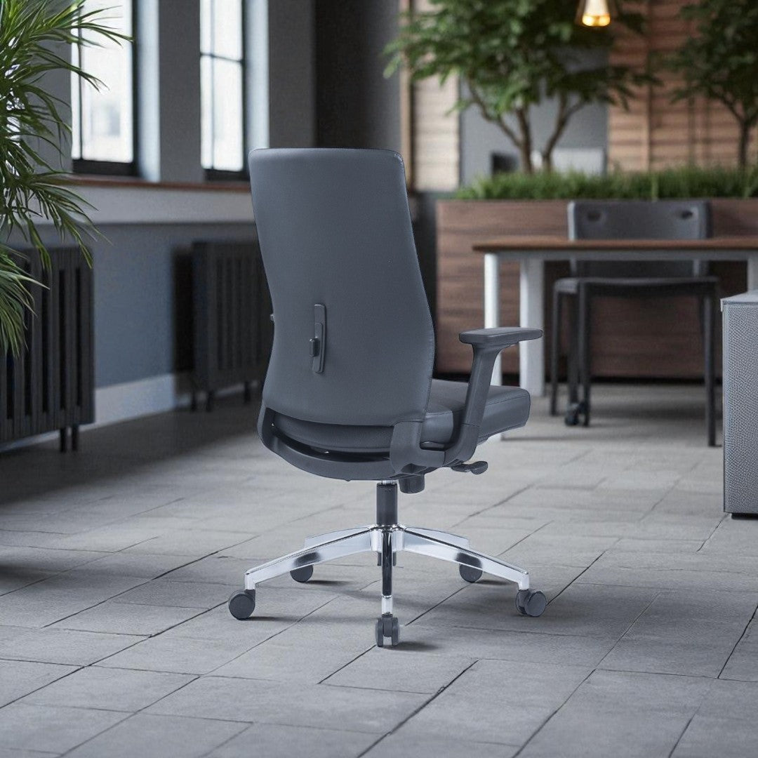 Gray office chair on a patio with plants and tables in the background