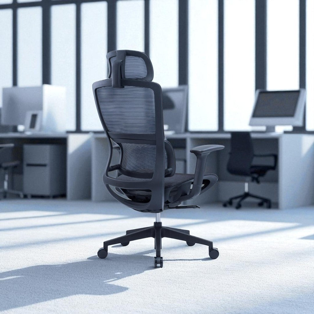 Ergonomic office chair in a modern office setting with desks and computers.