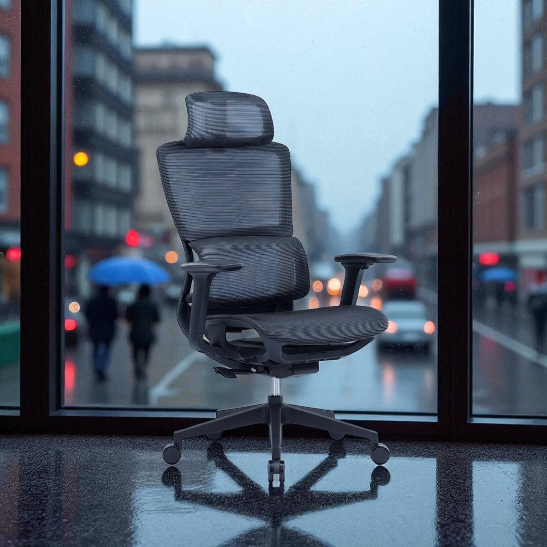 Ergonomic office chair in an office with a city street view outside the window.