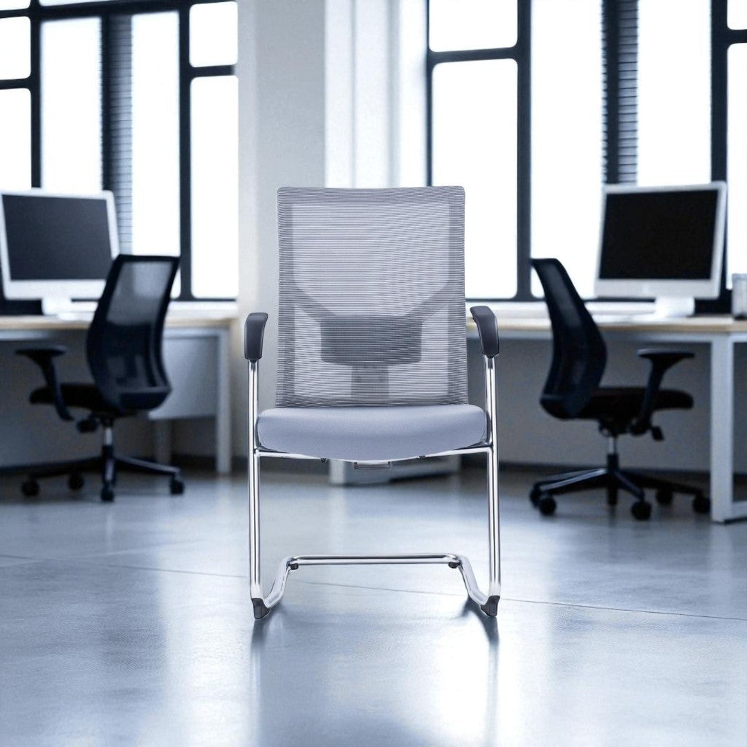 Gray office chair in a modern office setting with desks and computers.