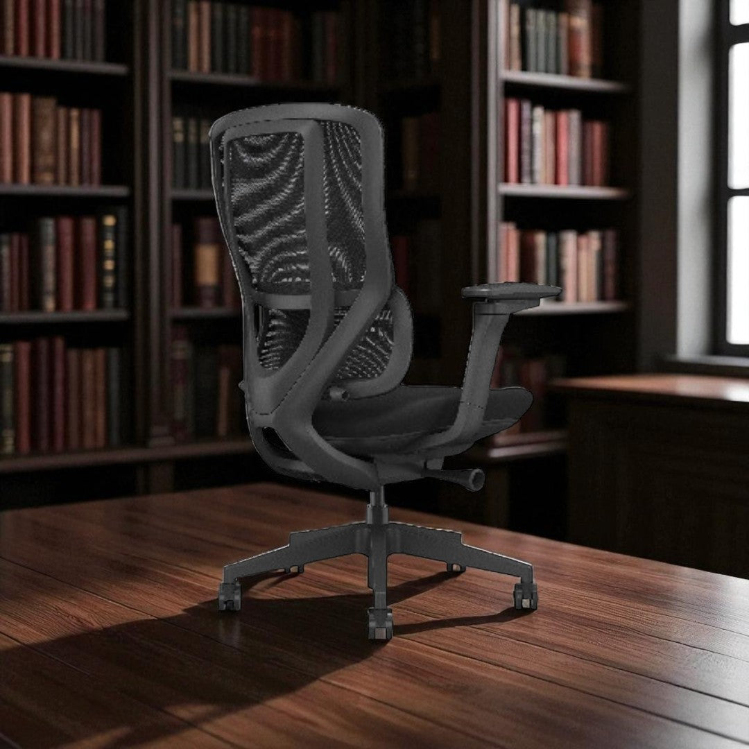 Gray office chair on a wooden desk with bookshelves in the background