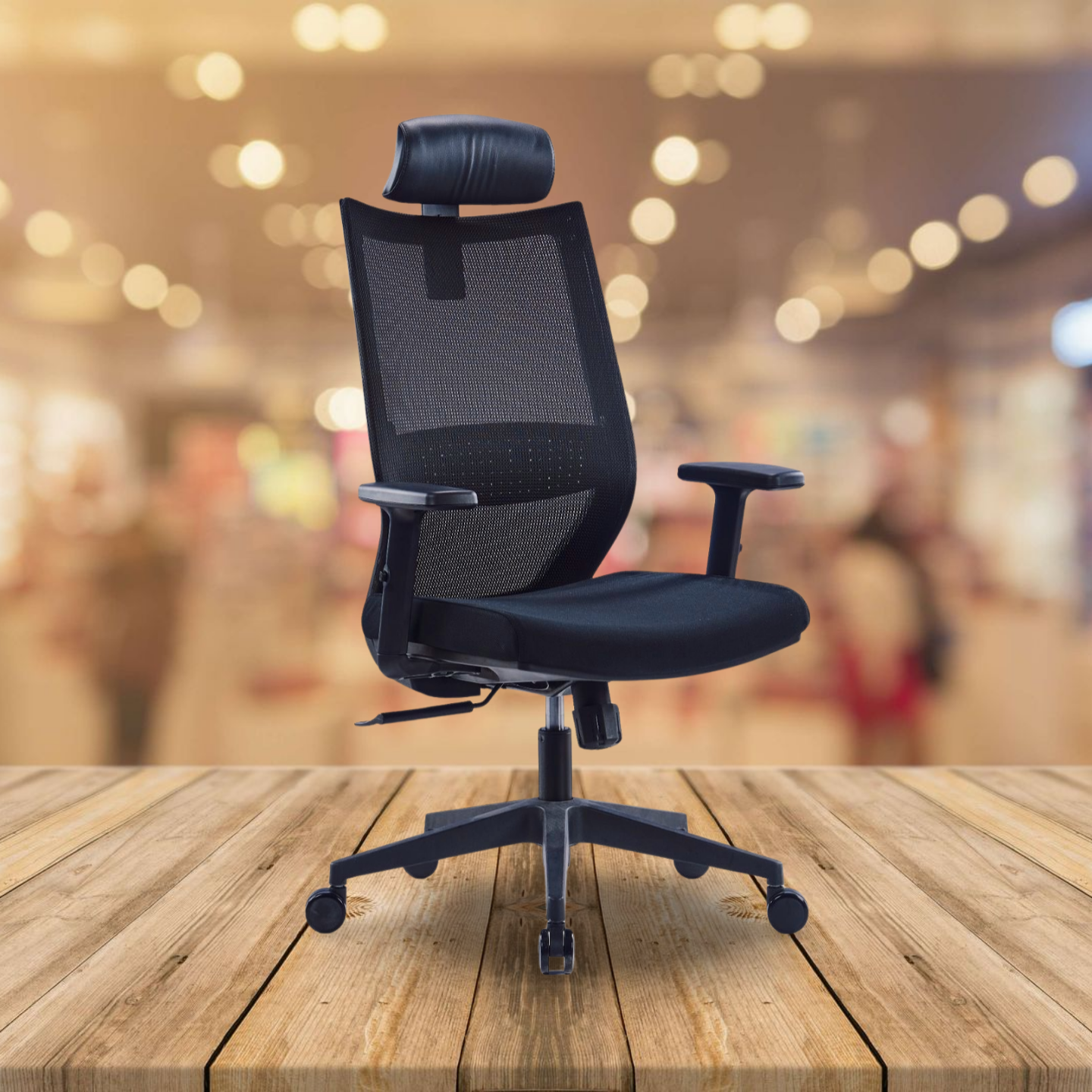 Black office chair on a wooden table with a blurred background