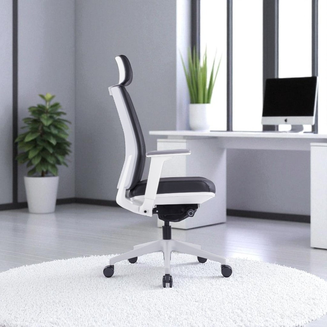 Modern office chair in a minimalistic office setting with a desk and plants.