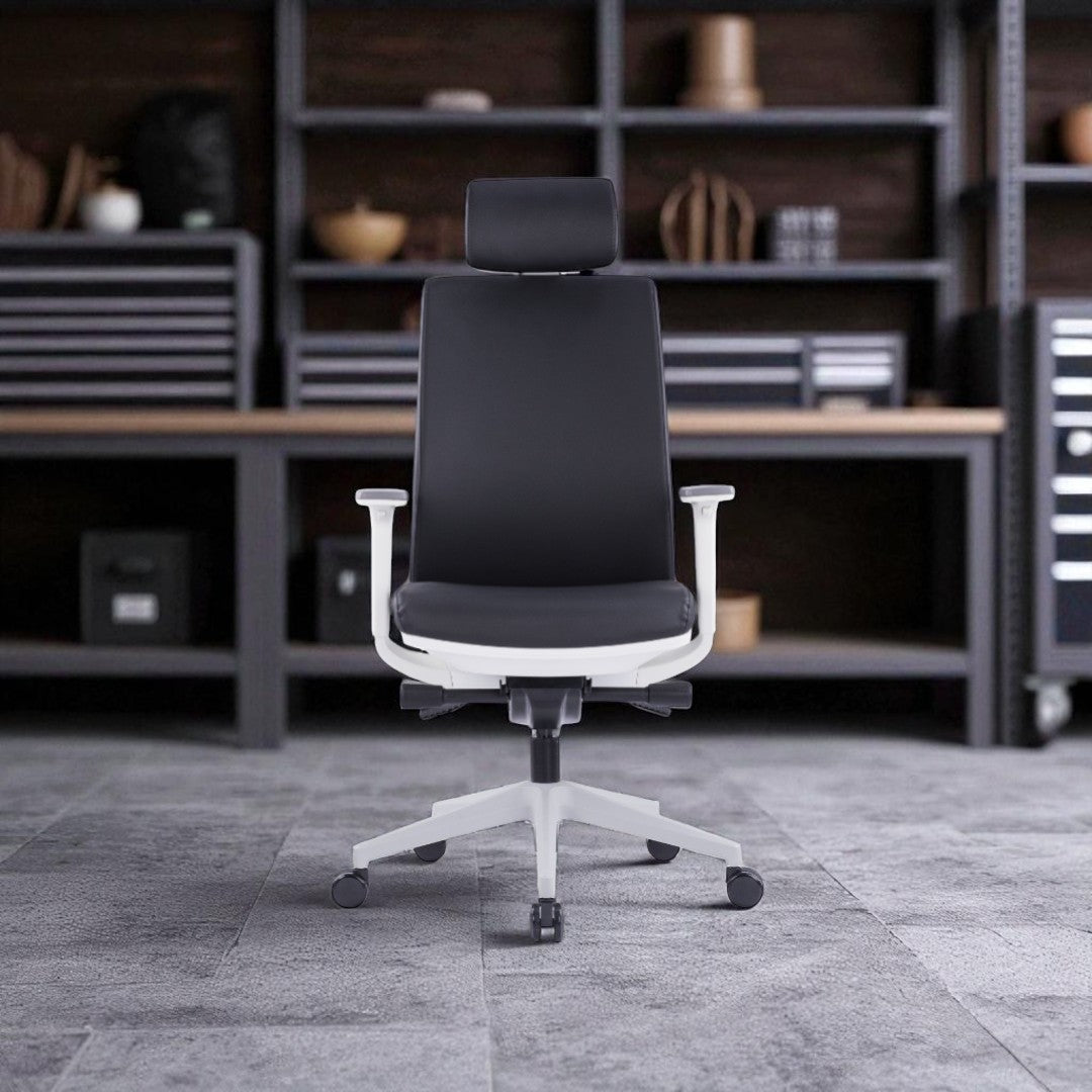 Black office chair in a modern office setting with shelves and desk.
