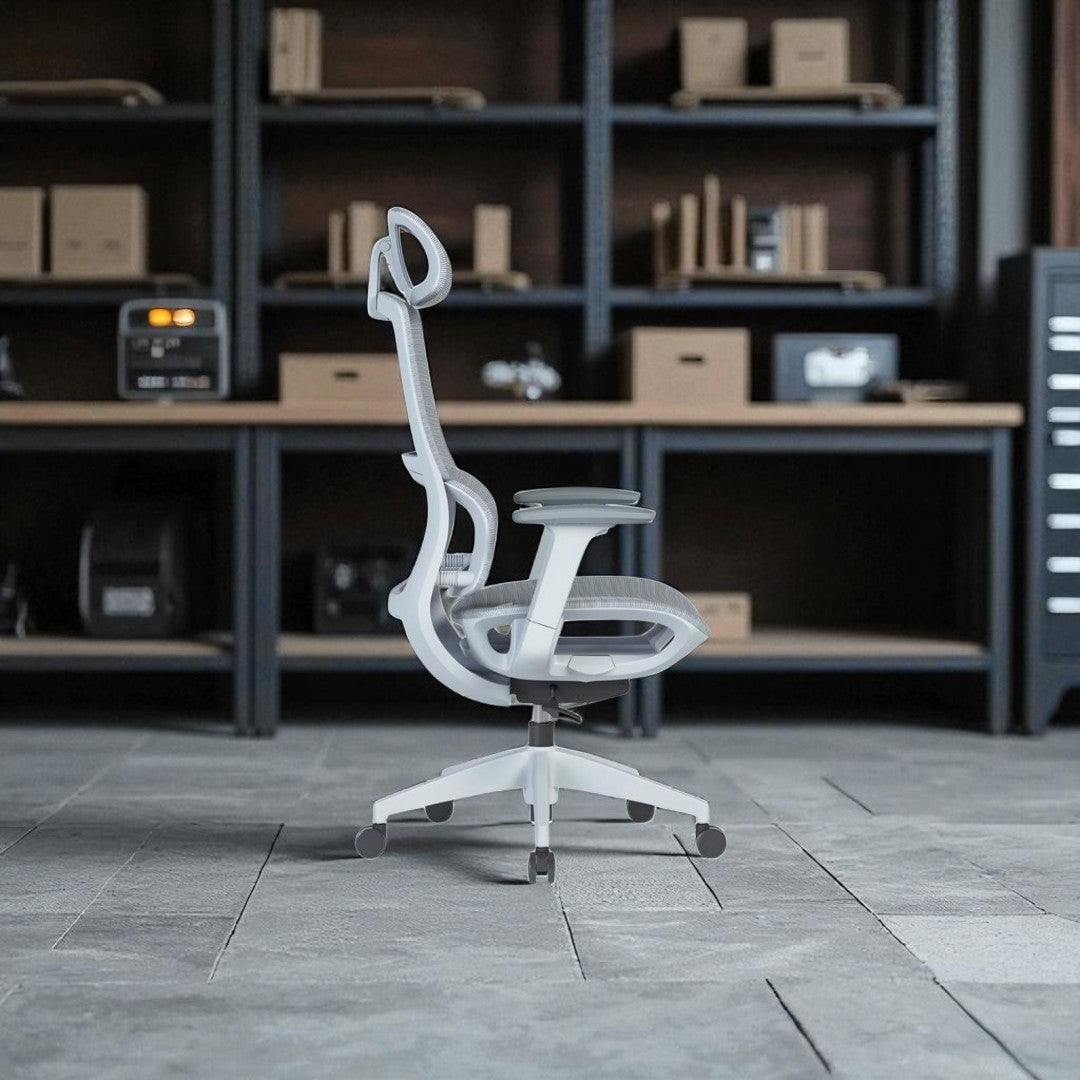 White ergonomic office chair in a room with shelves and equipment.