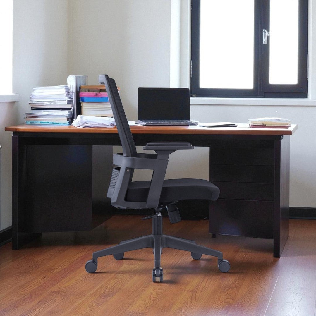Wooden desk with a laptop and office supplies, featuring a gray office chair.
