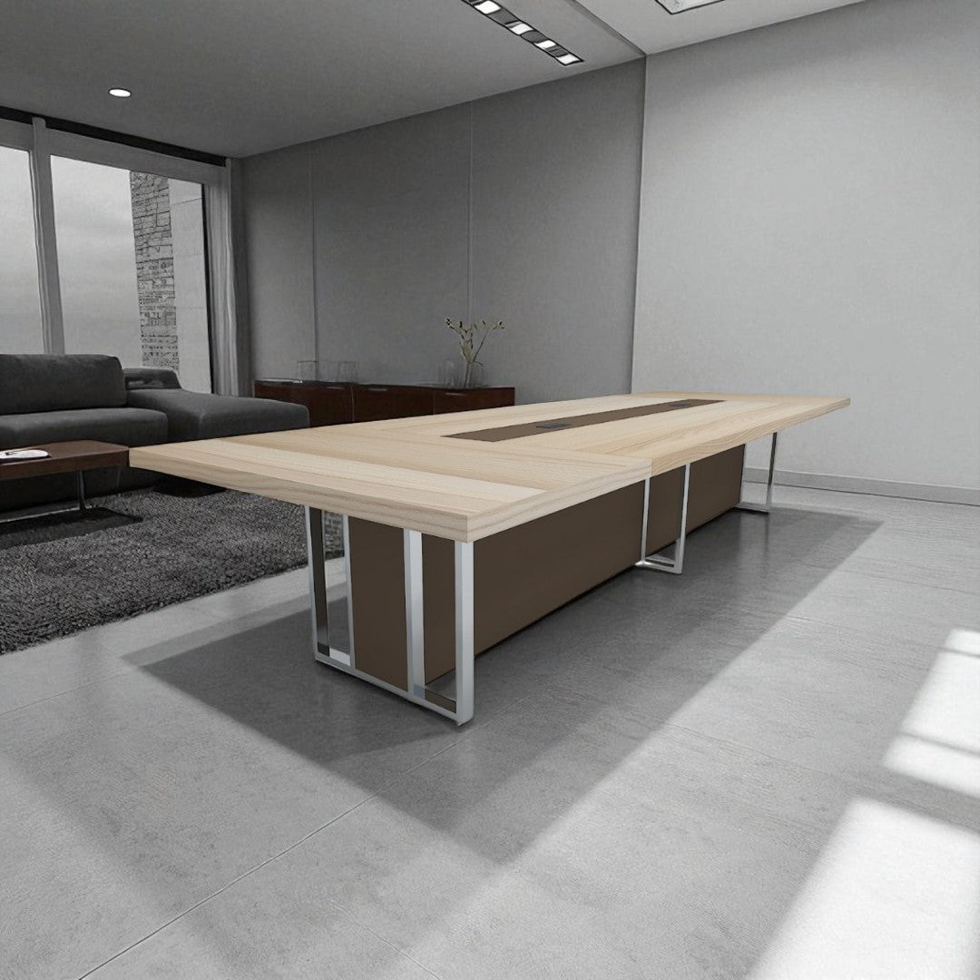 Modern office conference table in a room with gray walls and a gray rug.