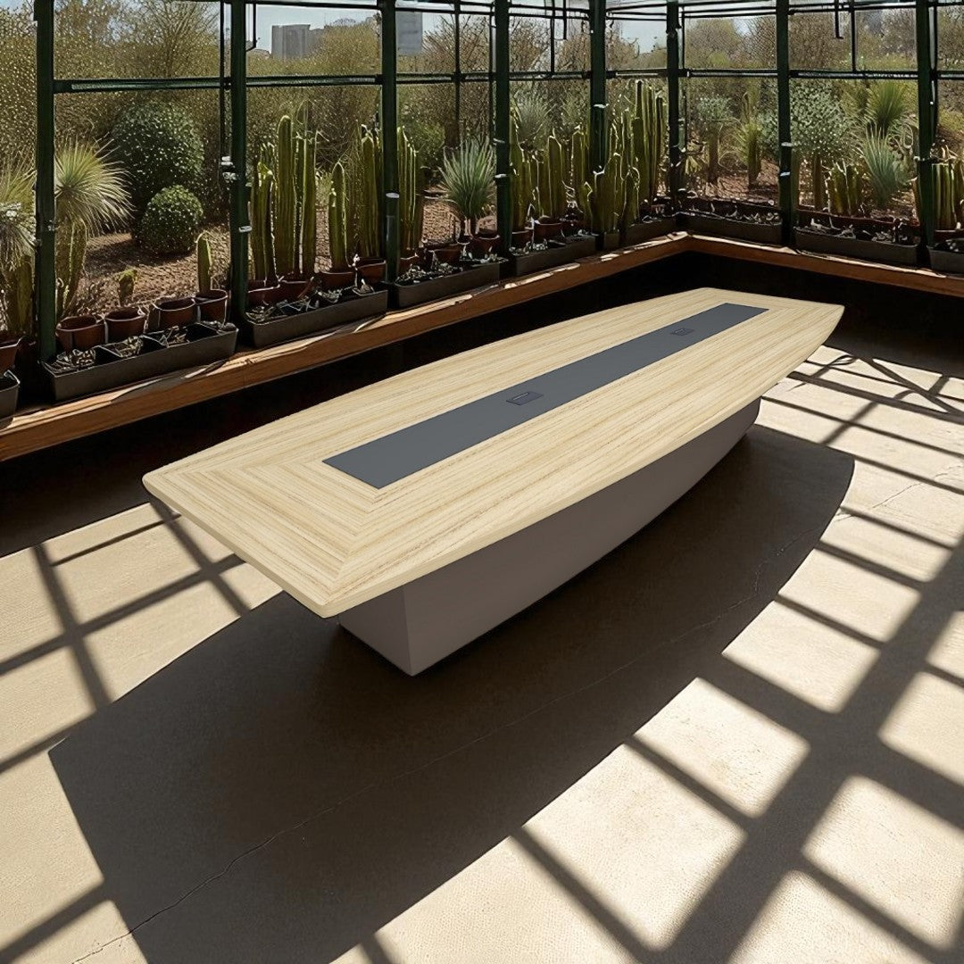 Modern conference table with a glass wall displaying cacti in the background