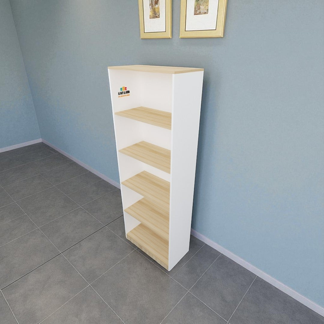 Tall white and light wood bookshelf against a blue wall with two framed pictures.